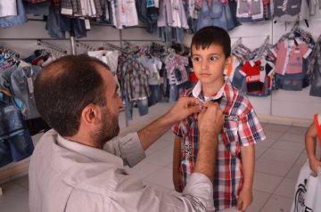 etkinlikdetay-bursa-umut-kervani-yetimleri-giydirdi-10.html